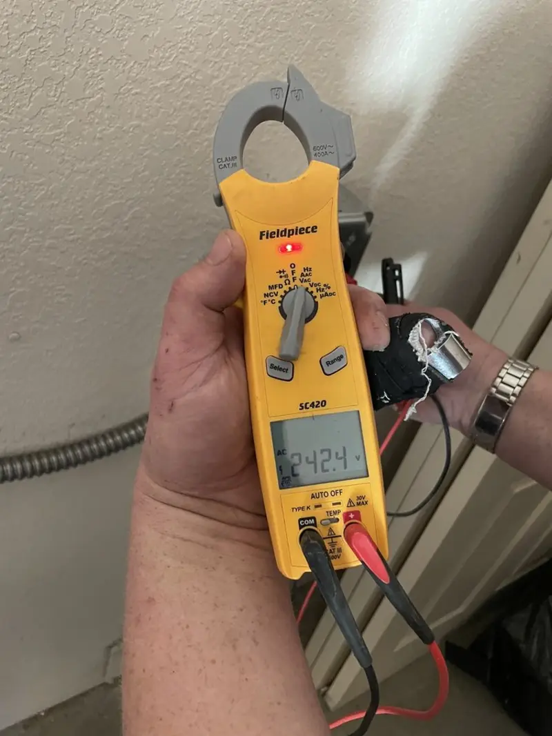 Voltage testing with clamp meter during Ceiling Fan Installation in Parker